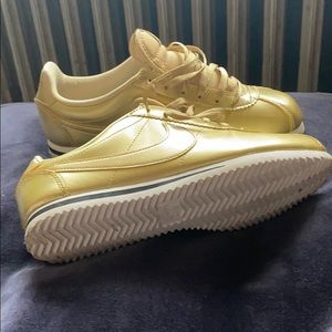 Gold leather Nike Cortez